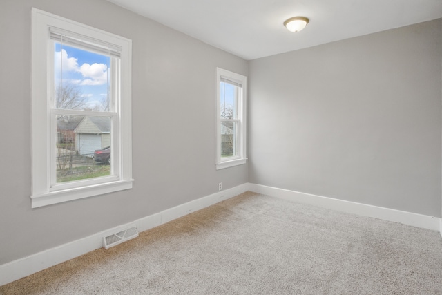 880 White Ave, Lincoln Park, MI 48146 - spare room with carpet flooring, baseboards, and visible vents