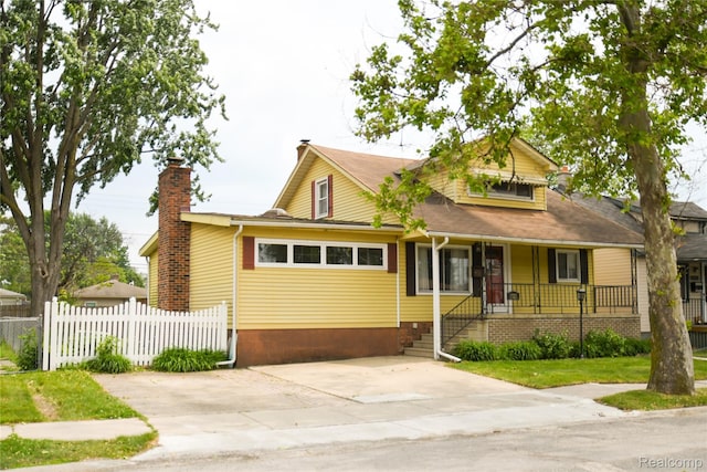 1521 Ferris Ave, Lincoln Park, MI 48146 - bungalow-style house featuring a chimney and a porch