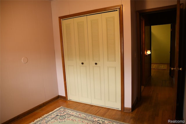 1521 Ferris Ave, Lincoln Park, MI 48146 - unfurnished bedroom featuring wood finished floors, a closet, and baseboards