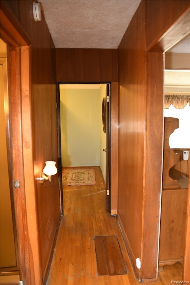 1521 Ferris Ave, Lincoln Park, MI 48146 - hallway featuring hardwood / wood-style flooring and a textured ceiling