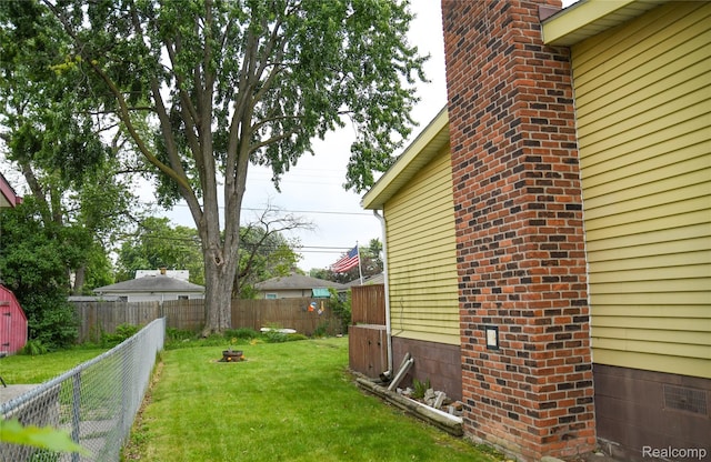 1521 Ferris Ave, Lincoln Park, MI 48146 - view of yard featuring a fire pit