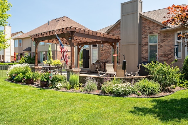 back of property featuring a lawn, brick siding, a chimney, and a pergola