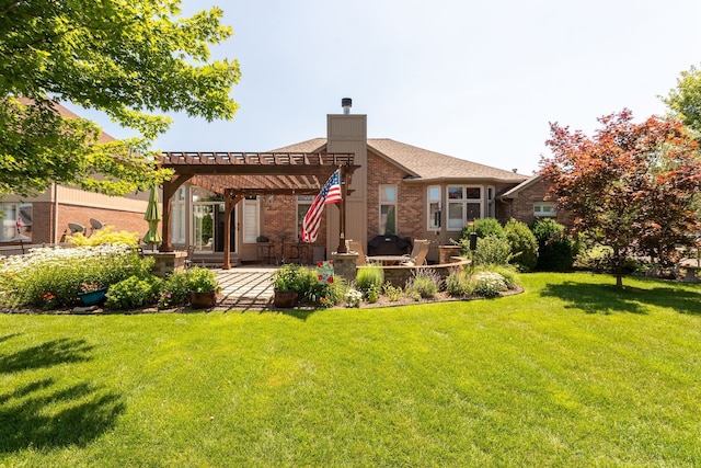back of house featuring a pergola, a patio, brick siding, a lawn, and a chimney