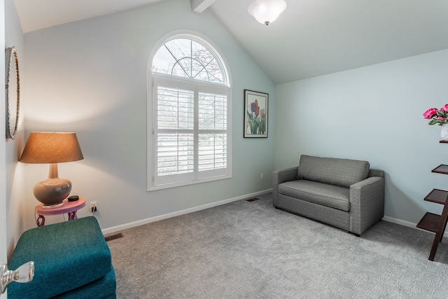 living area featuring lofted ceiling, visible vents, baseboards, and carpet floors