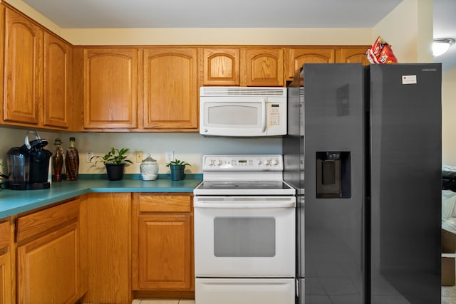 kitchen with brown cabinets and white appliances