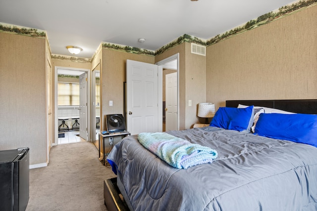 bedroom featuring visible vents, carpet flooring, and wallpapered walls
