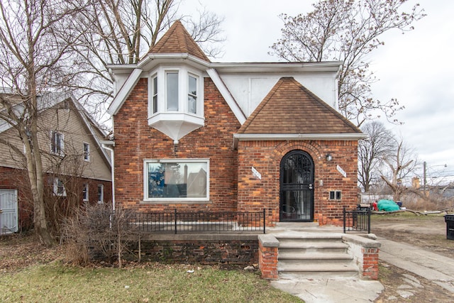 16917 Griggs St, Detroit, MI 48221 - tudor-style house featuring a shingled roof and brick siding