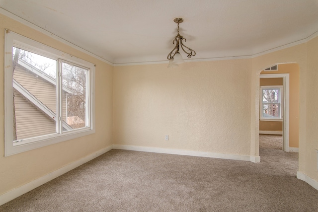 16917 Griggs St, Detroit, MI 48221 - empty room featuring arched walkways, carpet floors, baseboards, and crown molding