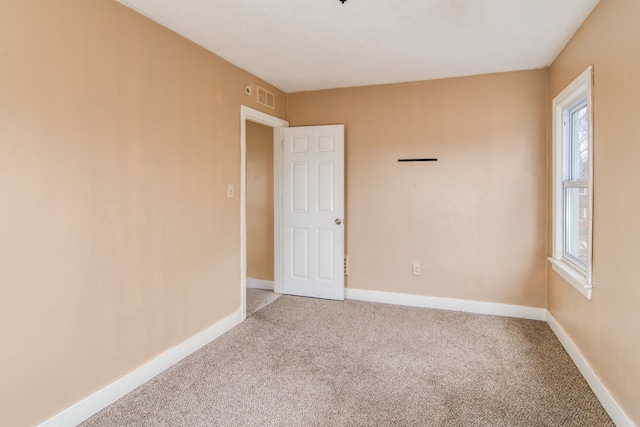 16917 Griggs St, Detroit, MI 48221 - spare room with baseboards, visible vents, and light carpet
