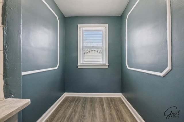 10088 Britain St, Detroit, MI 48224 - empty room with baseboards and dark wood finished floors
