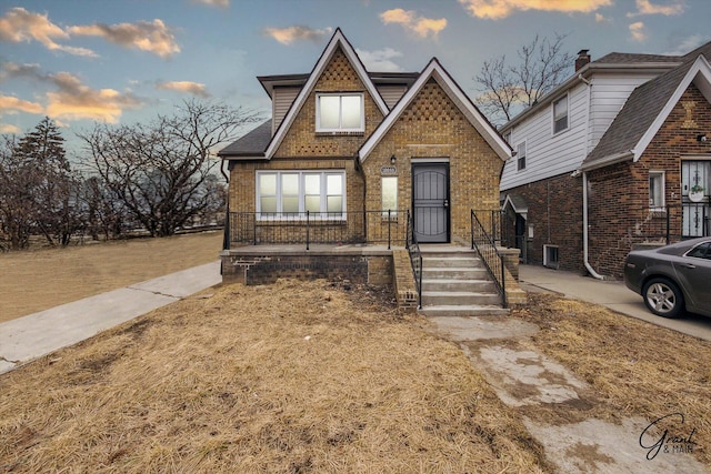 10088 Britain St, Detroit, MI 48224 - tudor house featuring brick siding