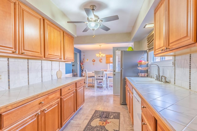 3803 Miller Rd, Kalamazoo, MI 49001 - kitchen with tile countertops, a sink, white dishwasher, and ceiling fan
