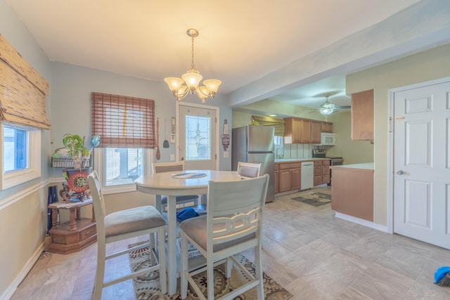 3803 Miller Rd, Kalamazoo, MI 49001 - dining space with a chandelier and baseboards