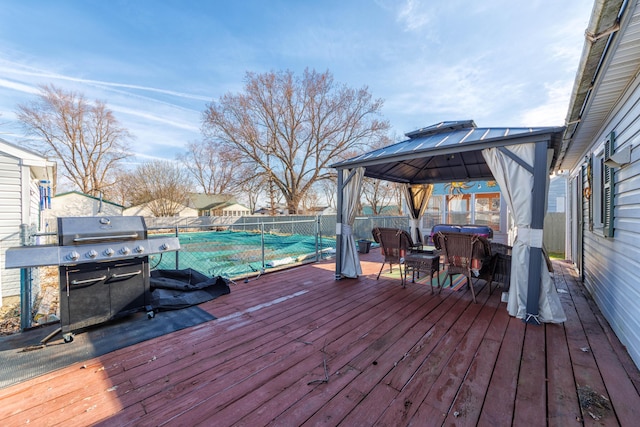 3803 Miller Rd, Kalamazoo, MI 49001 - wooden terrace with a gazebo, a fenced backyard, and an outdoor hangout area