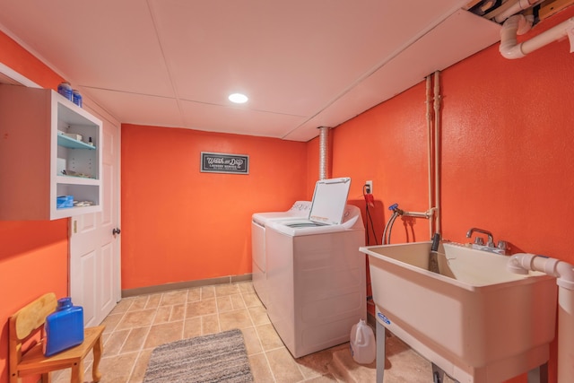 3803 Miller Rd, Kalamazoo, MI 49001 - laundry room with washing machine and clothes dryer, a sink, and recessed lighting