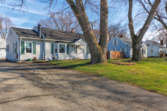 3803 Miller Rd, Kalamazoo, MI 49001 - new england style home featuring driveway and a chimney