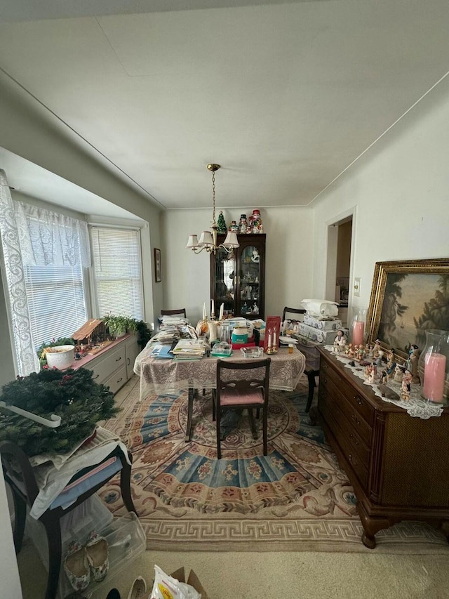 dining area with an inviting chandelier