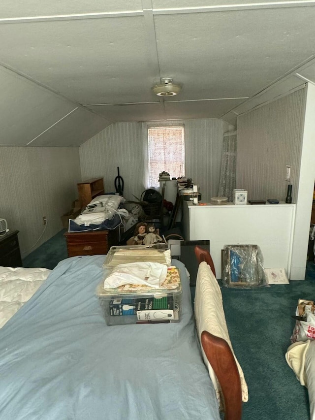 bedroom with carpet floors and vaulted ceiling