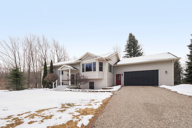 view of front of home featuring a garage and aphalt driveway