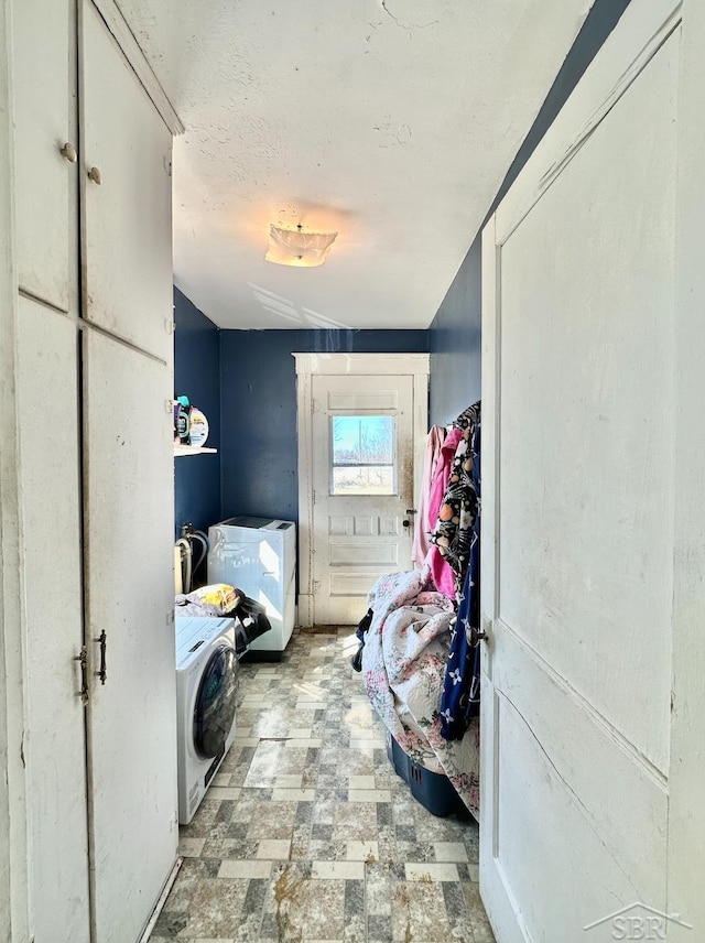 639 N Center St, Sebewaing, MI 48759 - clothes washing area with washer / dryer, laundry area, and a textured ceiling