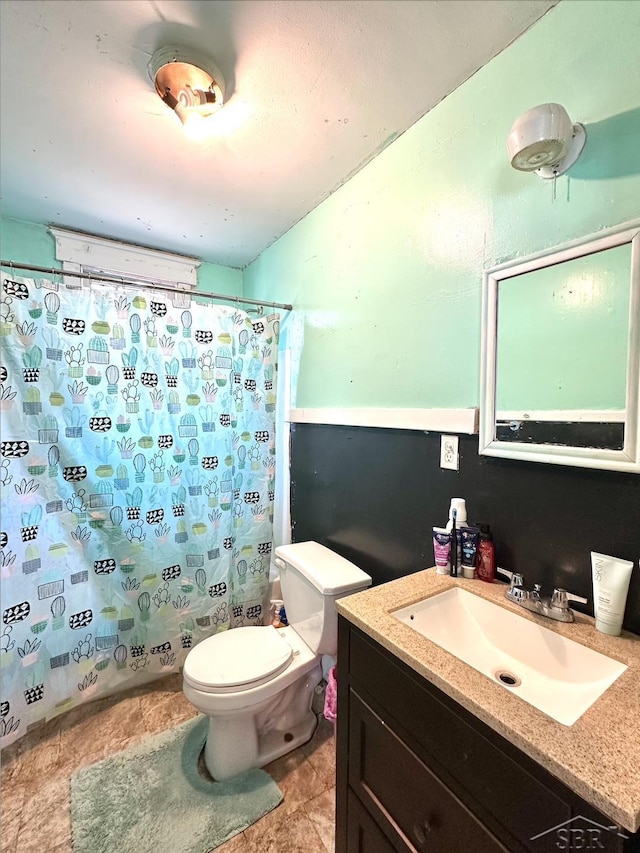 639 N Center St, Sebewaing, MI 48759 - full bathroom with toilet, shower / bath combo with shower curtain, and vanity