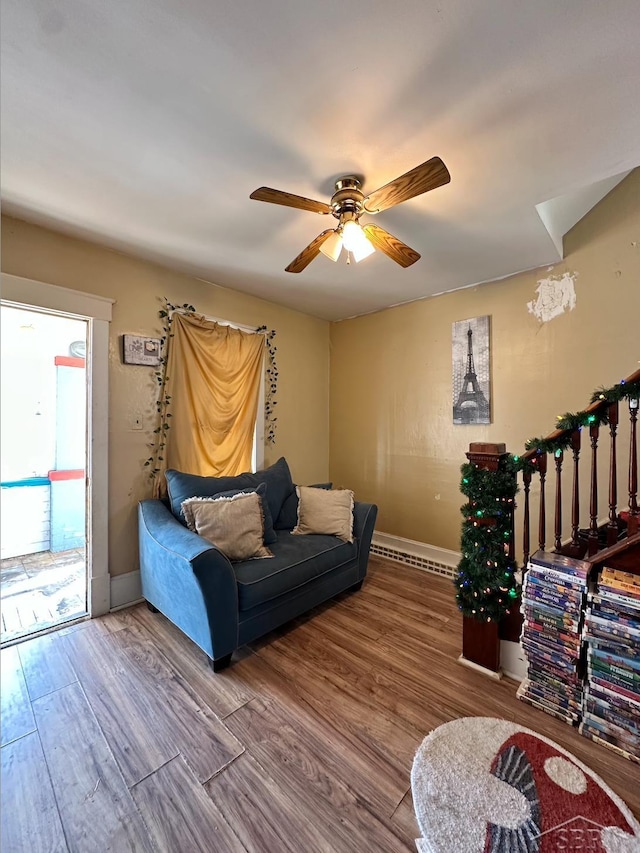 639 N Center St, Sebewaing, MI 48759 - living room with a ceiling fan, baseboards, and wood finished floors