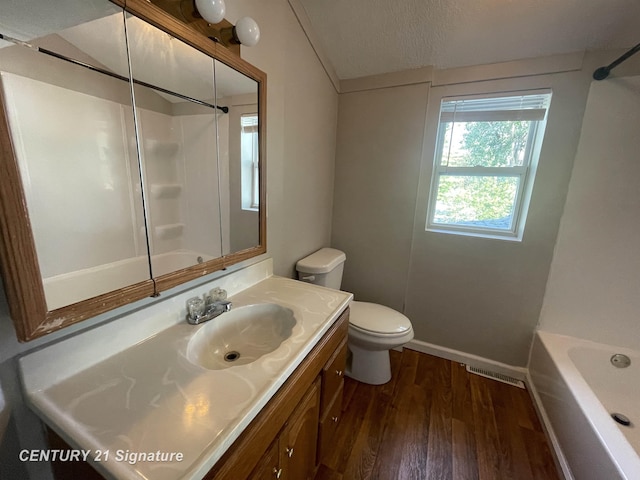 full bathroom with toilet, a bathtub, wood finished floors, walk in shower, and visible vents