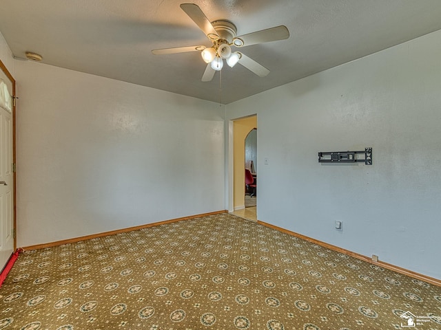 20212 Northline Rd, Taylor, MI 48180 - spare room featuring ceiling fan, arched walkways, a smoke detector, and baseboards