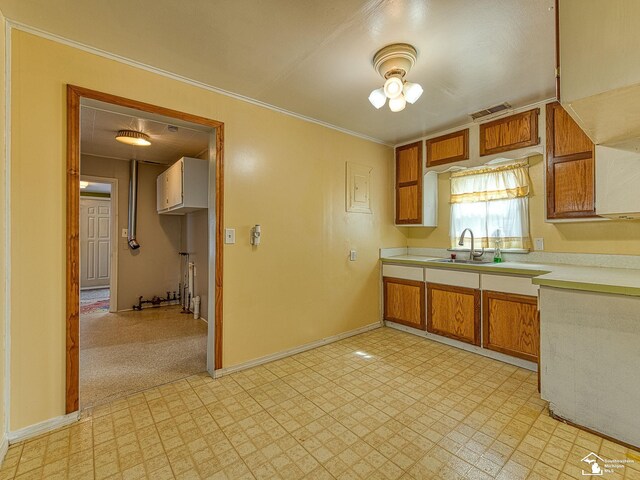 20212 Northline Rd, Taylor, MI 48180 - kitchen with a sink, light countertops, light floors, and ornamental molding