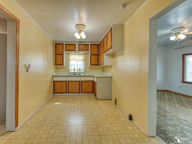 20212 Northline Rd, Taylor, MI 48180 - kitchen with baseboards and brown cabinetry