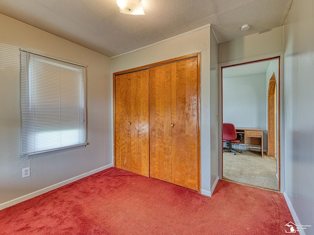 20212 Northline Rd, Taylor, MI 48180 - bedroom featuring carpet floors, a closet, a textured ceiling, baseboards, and a desk