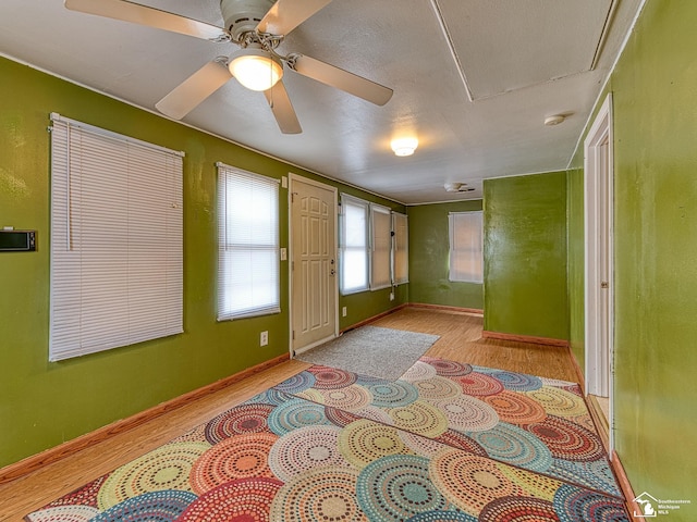 20212 Northline Rd, Taylor, MI 48180 - empty room with light wood-style floors, baseboards, a ceiling fan, and a smoke detector