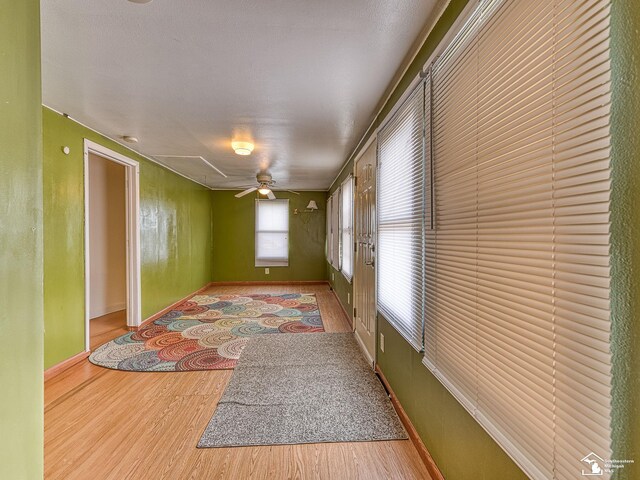 20212 Northline Rd, Taylor, MI 48180 - unfurnished room with wood finished floors, a ceiling fan, and baseboards
