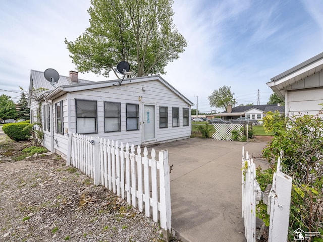 20212 Northline Rd, Taylor, MI 48180 - view of front of home with a chimney and metal roof