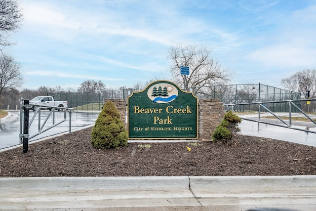 community sign featuring fence