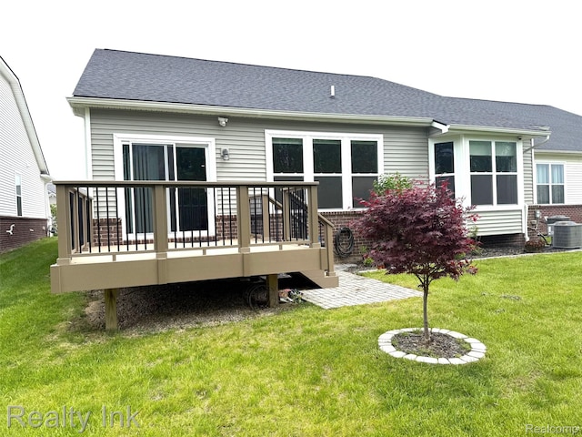 47653 Fowler Creek Dr, Canton, MI 48188 - rear view of house featuring central AC, a deck, a lawn, and a shingled roof