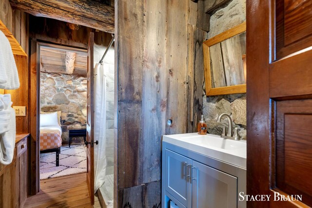 2620 36th St, Allegan, MI 49010 - interior space with wood finished floors, vanity, and a shower with curtain