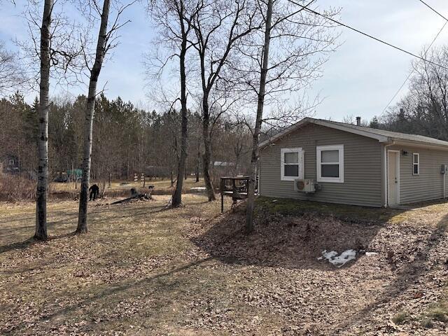 8034 N Johnson Rd, Irons, MI 49644 - view of side of home