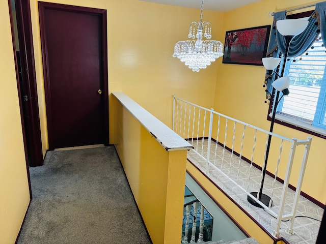 30347 Dell Ln, Warren, MI 48092 - hall featuring an upstairs landing, carpet flooring, and a chandelier