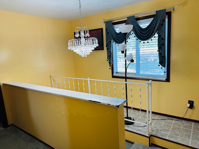 30347 Dell Ln, Warren, MI 48092 - hallway with a chandelier and an upstairs landing