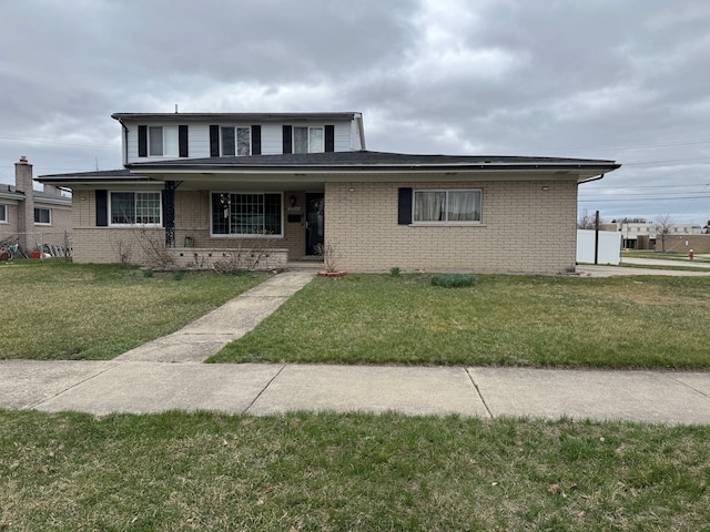 30347 Dell Ln, Warren, MI 48092 - traditional-style home with brick siding and a front yard