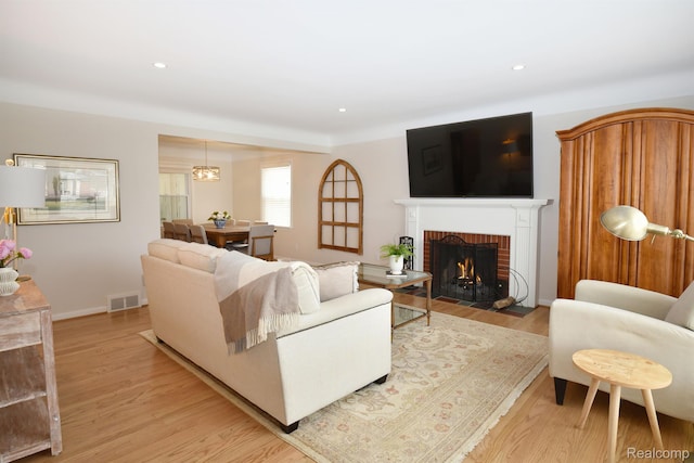 4121 S Fulton Pl, Royal Oak, MI 48073 - living room with light wood-style flooring, a fireplace, and recessed lighting