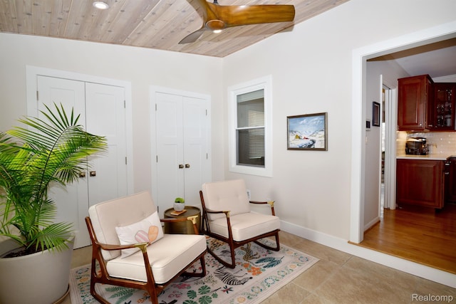 4121 S Fulton Pl, Royal Oak, MI 48073 - living area with ceiling fan, light tile patterned floors, and wood ceiling