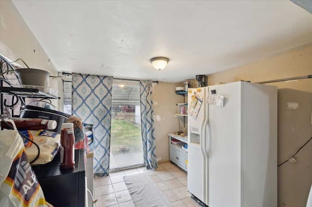 kitchen with light tile patterned flooring, open shelves, and white fridge with ice dispenser