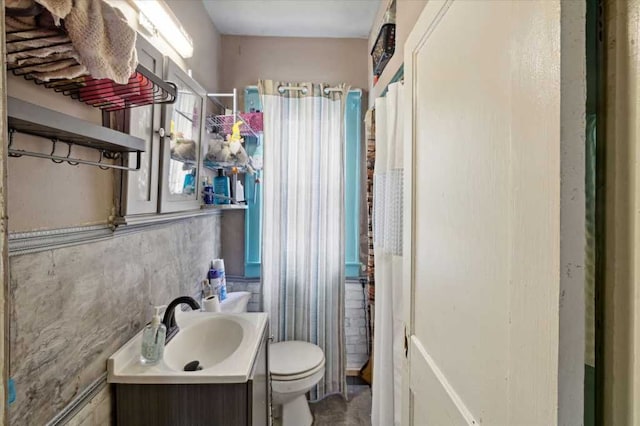 bathroom featuring toilet and vanity