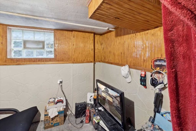 interior space with concrete block wall