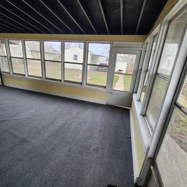 unfurnished sunroom featuring a wealth of natural light