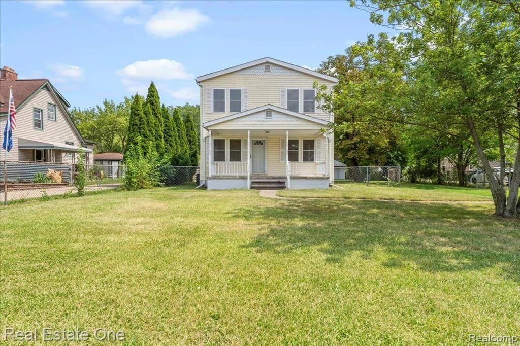 14225 Reeck Rd, Southgate, MI 48195 - view of front of property with a front lawn, a porch, and fence