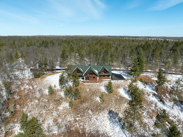 birds eye view of property with a view of trees