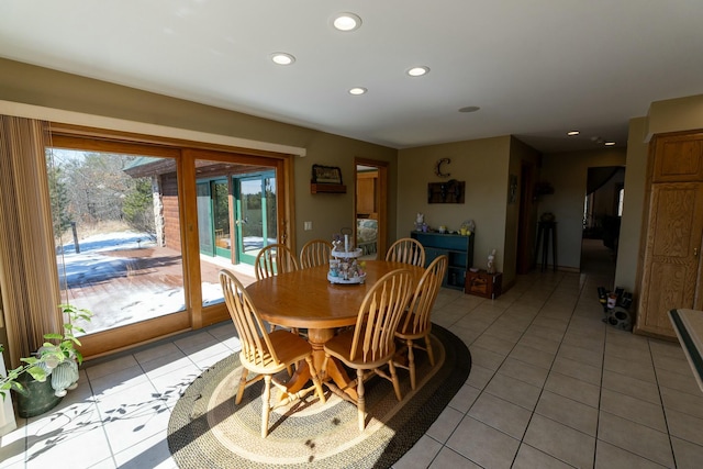 dining area with light tile patterned flooring and recessed lighting